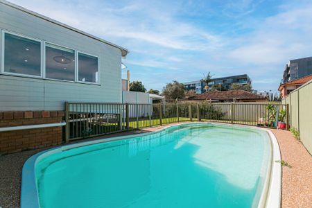 Newly Renovated Charming Home with Pool and Lock up Garage - Photo 2