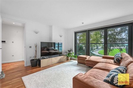 Available Now & Part Furnished, A beautifully presented two-bedroom apartment located on the first floor of the prestigious riverside development, New Providence Wharf. - Photo 3