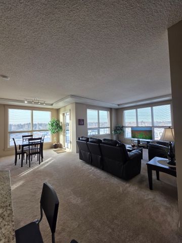 Experience urban elegance in this modern, FULLY FURNISHED, ALL-INCLUSIVE, executive 2-bedroom, 2-bathroom condo. - Photo 2