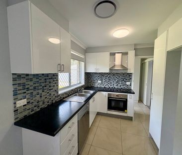 Neat & Affordable Four-Bedroom Home - Photo 4