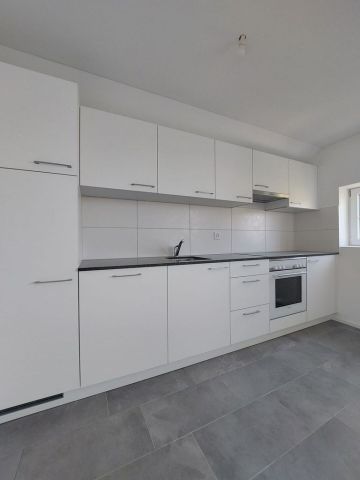 Appartement de 2,5 pièces au 2ème étage avec jardin commun - Photo 2