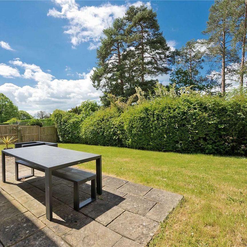 A detached family home set in a quiet no through road location within a short drive of Oxshott station. - Photo 1