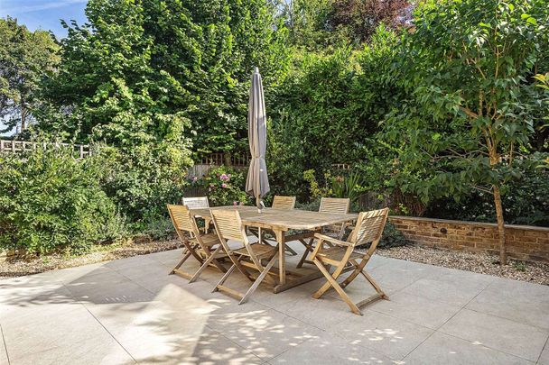 A Grade II Listed three bedroom terraced house with off street parking and set behind gates. - Photo 1