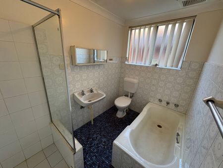 Freshly Painted 2-Bedroom Unit in Convenient Location - Photo 2