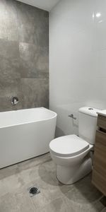 Modern three bedroom unit - 20% below market rent - Photo 3