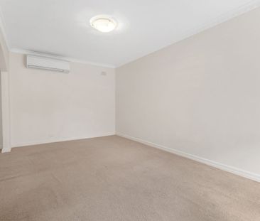WELL LOCATED, IMMACULATE, TWO BEDROOM UNIT - Photo 1