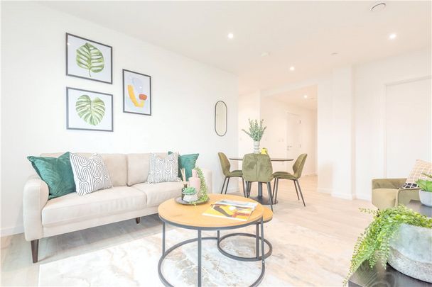 This contemporary two-bedroom apartment is located within Wallbrook Gardens, a beautiful development benefitting from exceptional on-site amenities, communal gardens and only a 6-minute walk to Canning Town Station. - Photo 1