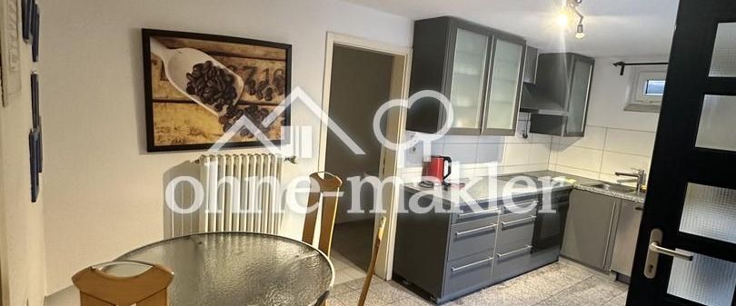 Souterrain 2-Zimmer-Wohnung mit eigenem Eingang, Einbauküche & zusätzlichem Arbeits-/Hobbybereich - Foto 1