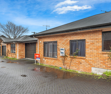 This tidy, two bedroom townhouse is situated within walking distanc... - Photo 2