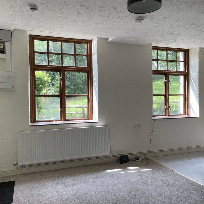 A charming two-bedroom ground floor flat situated within the old coach house for Pennant Hall. - Photo 1