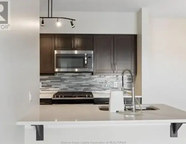 250 MANNING ROAD Unit# 504 | 250 MANNING ROAD Unit# 504, Tecumseh - Photo 1