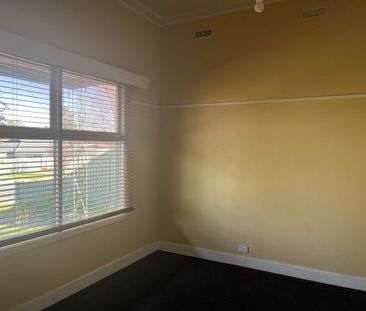 IDEALLY SITUATED AND UPDATED THREE BEDROOM HOME - Photo 1