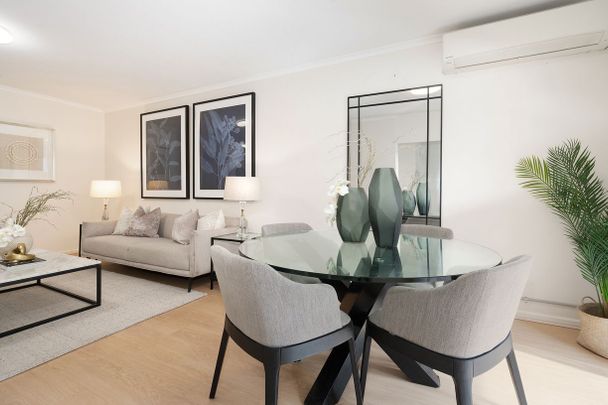 Peaceful rear-of-block apartment in a prime walk-to-everything location - Photo 1