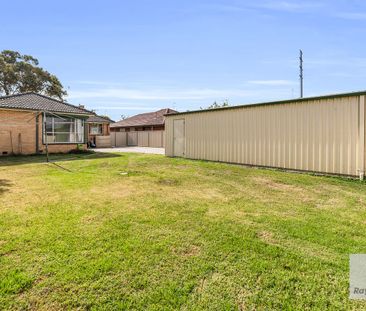 Charming 3-Bedroom Home with Large Fenced Yard and Prime Location - Photo 4