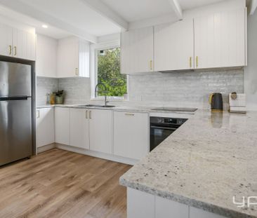 Renovated Coastal Comfort with Bonus Bungalow Living - Photo 5