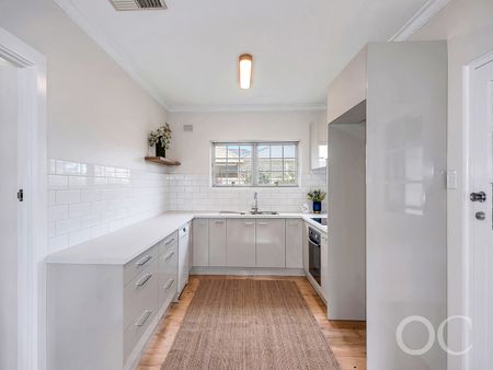 Open the Door to Classic Comfort Just Steps from the Coast - Photo 3