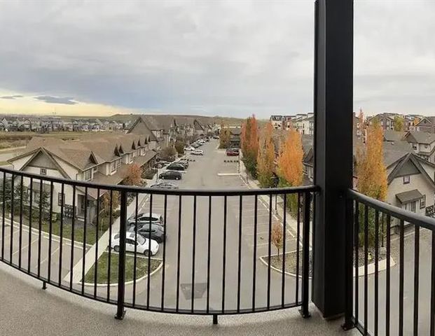 Top Floor 1 Bedroom + 1 Den Condo Unit | 420 - 117 Copperpond Common South East, Calgary - Photo 1