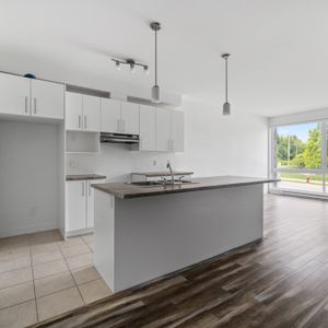 Appartement 2 Chambres + Den - Photo 3