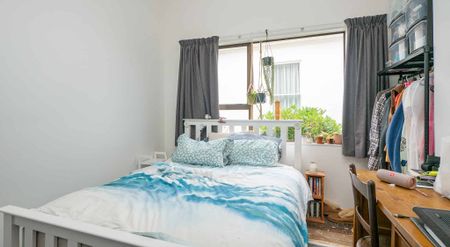 Spacious Three-Bedroom Brick Home with Garage and Fenced Backyard! - Photo 4