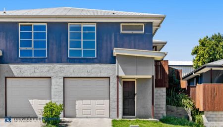 This upscale townhouse features open-concept living at its finest with a sophisticated, contemporary style. - Photo 5