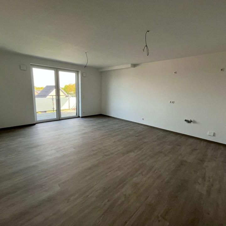 Modernes Wohnen - Exklusive DG-Wohnung in top Lage - Erstbezug - Photo 1