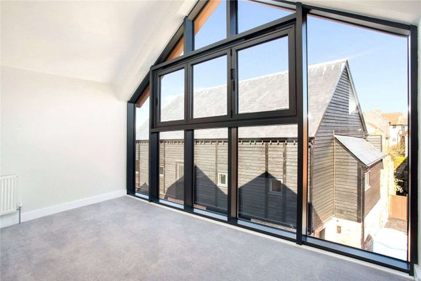 A two bedroom home with a private balcony, under croft parking for two cars and store, located in the heart of Salisbury - Photo 1