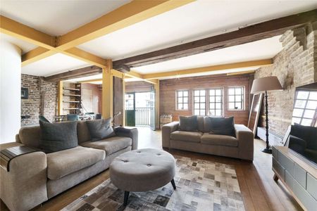 Set within a characterful period building, the property seamlessly blends industrial charm with contemporary living. - Photo 3