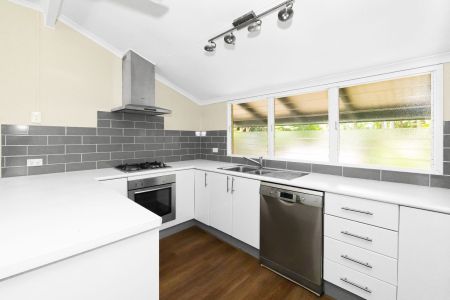 Elevated 4-bedroom home with granny flat - Photo 4