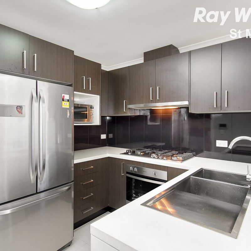 NEAR NEW 4 BEDROOM TOWN HOME WITH DOUBLE GARAGE - WALK TO ROOTY HILL TRAIN STATION - Photo 1