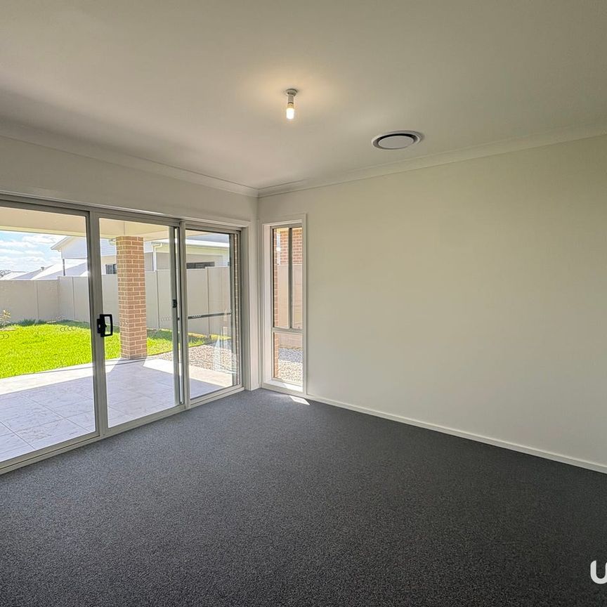 Four Bedroom Home with Extra Large Living Areas! - Photo 1