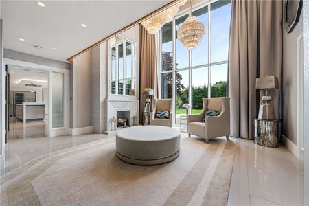 An exceptional contemporary home of over 5,000 sq ft, set behind electric gates on one of Hale Barns' most prestigious roads. - Photo 2