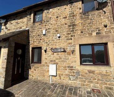 A three bedroom mid-terrace two storey barn conversion with a garage. - Photo 1