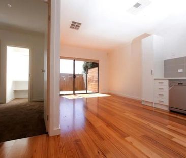 MODERN UNIT WITH PRIVATE COURTYARD AND CARPORT - Photo 3