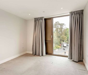 A modern third floor, two bedroom apartment with parking - Photo 5