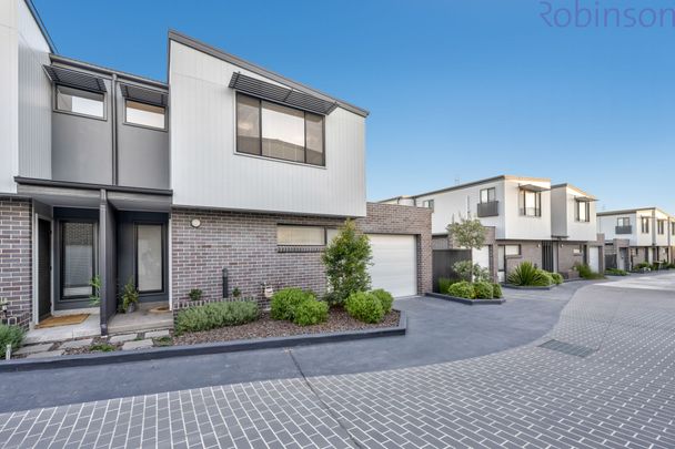 Modern three bedroom, two bathroom townhouse with air-conditioned living space. - Photo 1