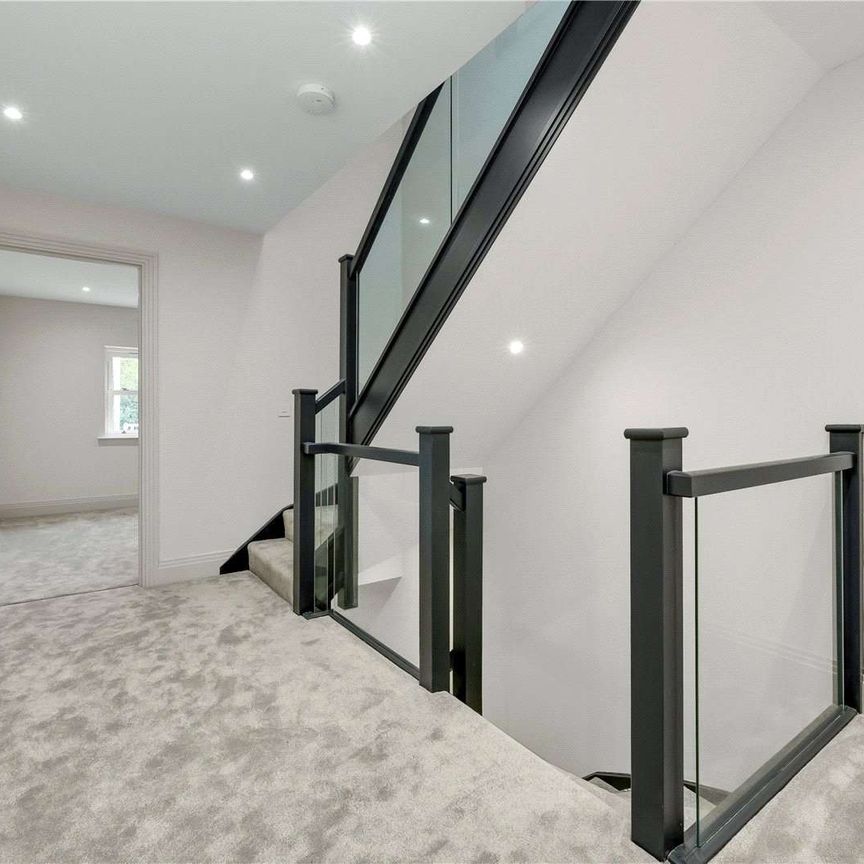 Beautifully finished new-build home just 0.5 miles from Walton-On-Thames Station. This five bedroom family residence combines contemporary design and cutting-edge technology. - Photo 1