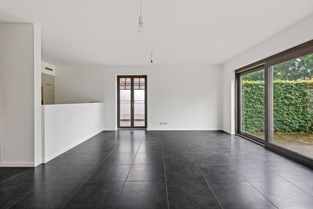 Gelijkvloers app. met tuin in het centrum van 's Gravenwezel. - Photo 3