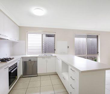 Inviting 4-Bedroom Residence with Modern Comforts - Photo 1