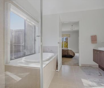Expansive Family Living with Two Main Bedrooms - Photo 5