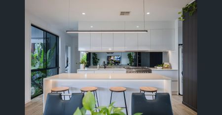 Stylish Four-Bedroom Home With Poolside Living - Photo 5