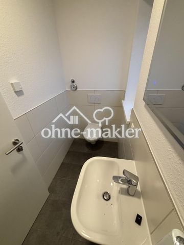 Erstbezug: 3-Zimmer Dachgeschoss Wohnung in energieeffizientem KFW55 Haus - Photo 4