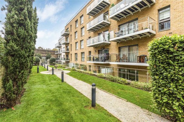 A superb two bedroom second floor flat in this desirable gated development moments from East Putney underground station with allocated parking. - Photo 1