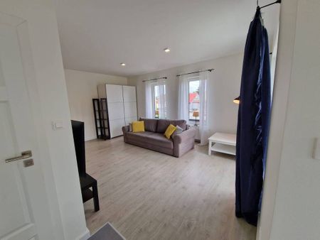 Dwupoziomowe mieszkanie przy ul. Okulickiej - Zdjęcie 2