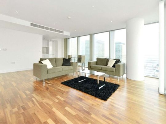 A luxury interior designed three bedroom apartment situated on the thirty seventh floor, over looking Canary Wharf. - Photo 1