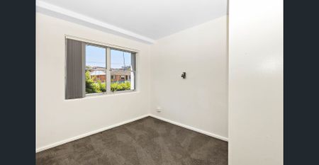 Available NOW: Walk-to-Town Convenience in a Well-Positioned Two-Bed Unit - Photo 2