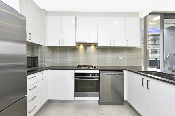 Top-Floor Penthouse with Dual Balconies | District Views - Photo 1