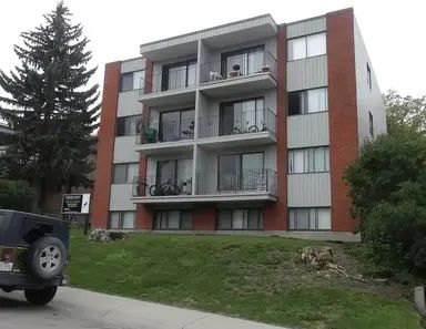 Cedar Place 1 bedroom $1500 - New laminate hardwood flooring | 2111 16a St SW, Calgary - Photo 1