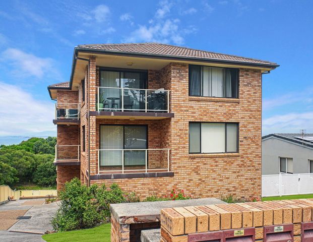 COSTAL LIVING AWAITS AT 4/11 SURFSIDE DRIVE - Photo 1