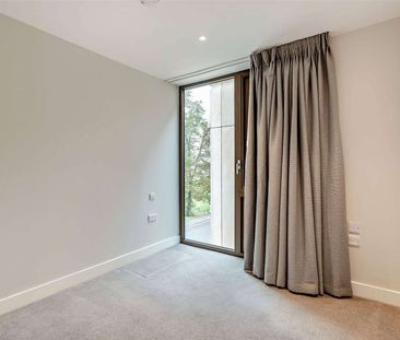 A modern third floor, two bedroom apartment with parking - Photo 6