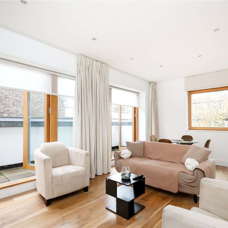 A spacious penthouse in central Putney. - Photo 1